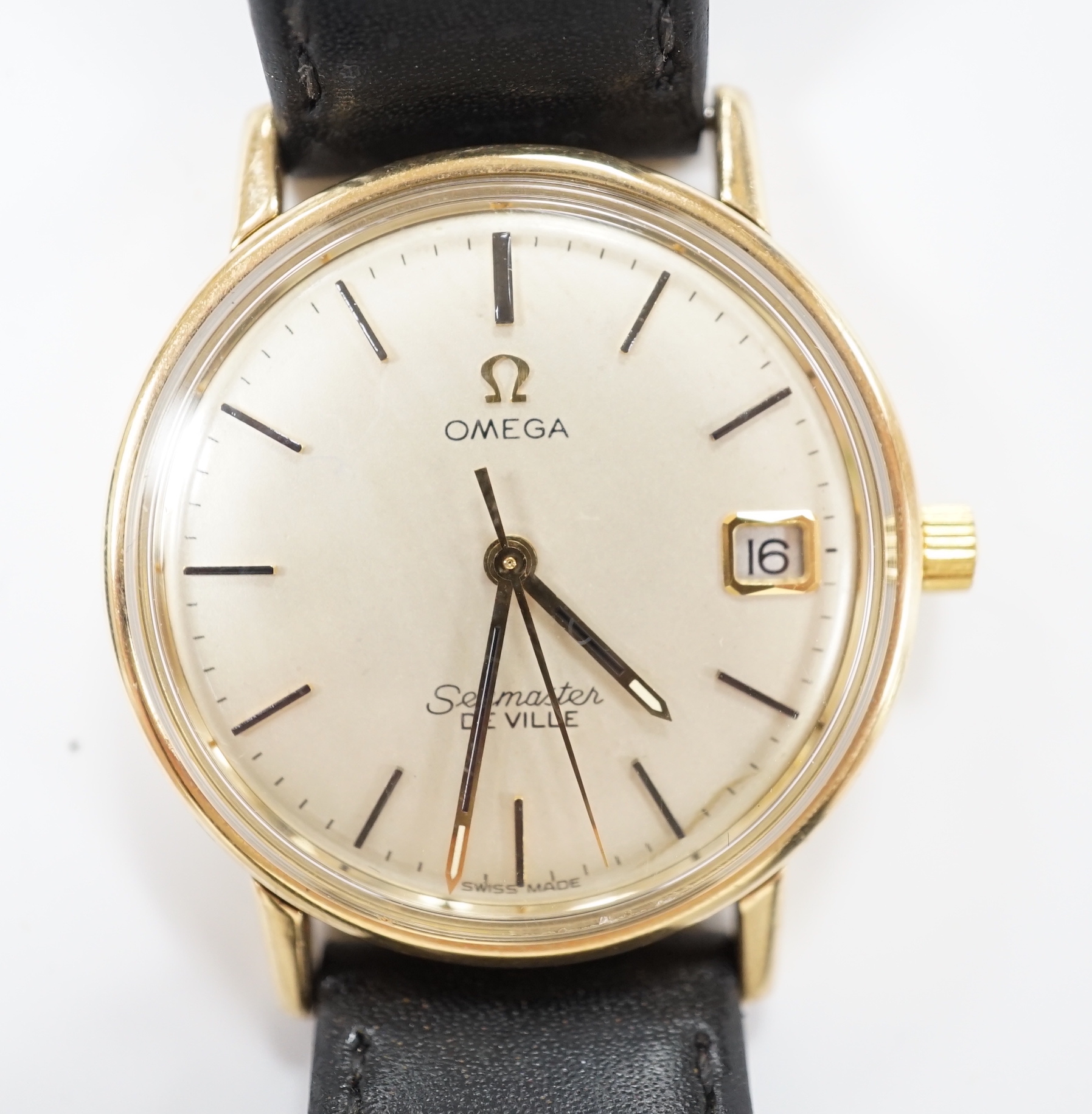 A gentleman's yellow metal Omega Seamaster De Ville manual wind wrist watch, on associated leather strap, case diameter 34mm, no box or papers.